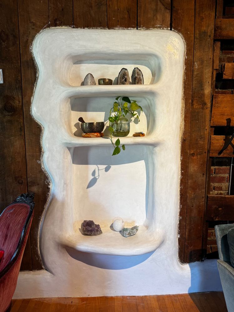 Sculpted plaster wall niche with shelves at The Tavern