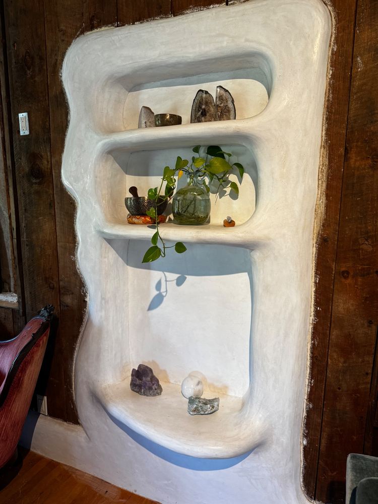 Sculpted plaster wall niche with shelves at The Tavern