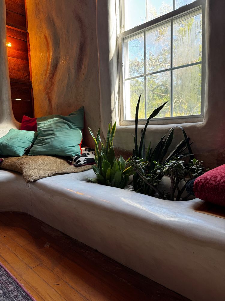 Plaster window bench with built-in planter at The Tavern