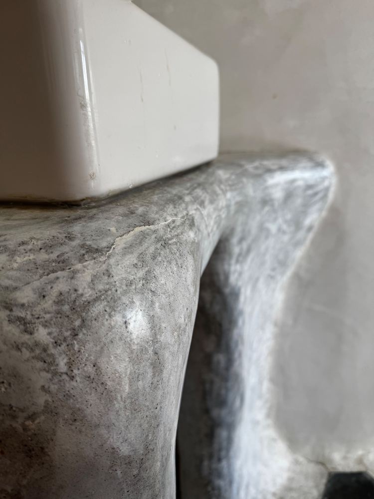 Sculpted plaster bathroom vanity at The Tavern